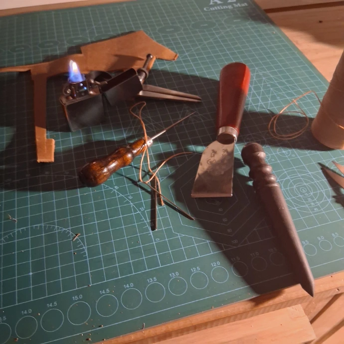 Image of leatherworking tools on workbench