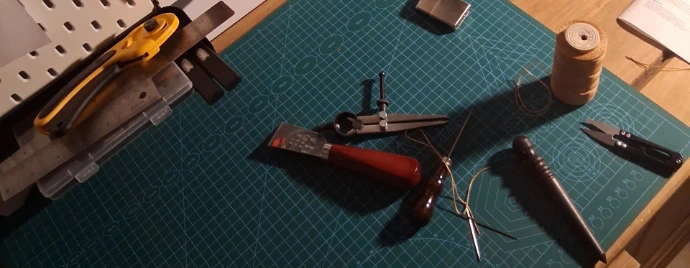 Image of leatherworking tools on workbench